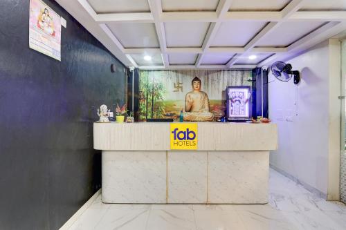 a counter in a room with a sign on it at FabHotel Radha Rani Residency in Khammam