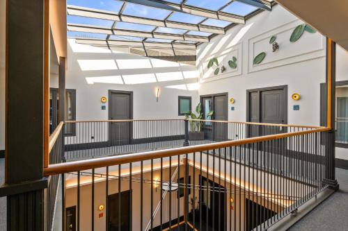 an inside view of a building with a skylight at Casa Alhaja by Shiadu in Seville