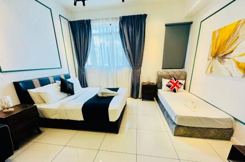 a hotel room with two beds and a window at Chamber Suites KL At Sky World in Kuala Lumpur