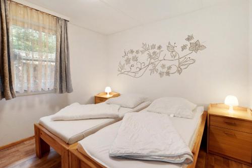 Ένα ή περισσότερα κρεβάτια σε δωμάτιο στο Bungalow 14 - Finnhütte