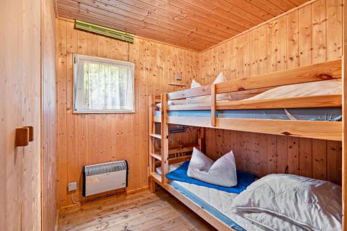 Ένα ή περισσότερα κρεβάτια σε δωμάτιο στο Bungalow 18 - Finnhütte