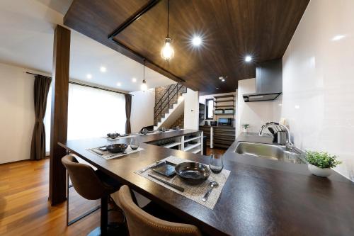 a kitchen with a large counter and a sink at 北の杜ピリカ輪厚 in Kitahiroshima