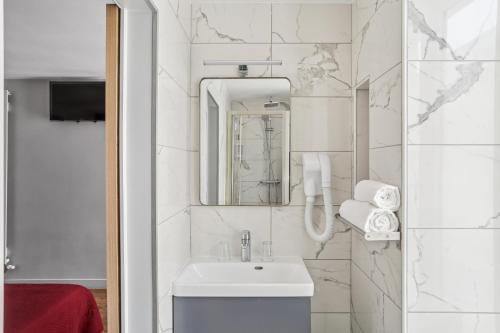 Koupelna v ubytování Hotel Telemaque