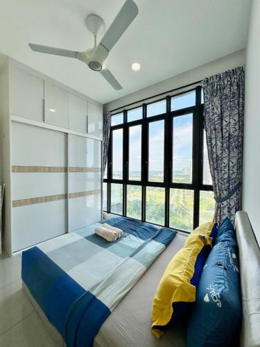 a bedroom with a bed with a large window at D'pristine 4 bedroom condo 1725 opposite Legoland and Medini mall in Iskandar Puteri