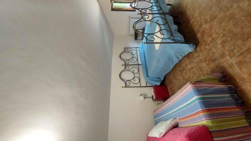 a small room with a bed and a stairway with at ApartRelax in SantʼEufemia a Maiella