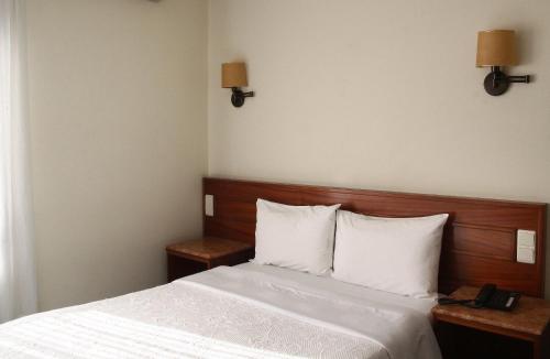 Un ou plusieurs lits dans un hébergement de l'établissement Hotel Aeroporto