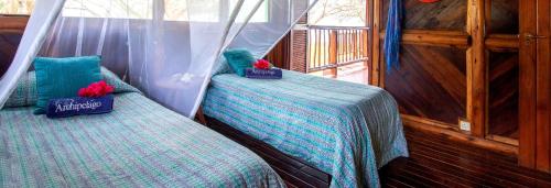 Un pat sau paturi într-o cameră la Archipelago Resort