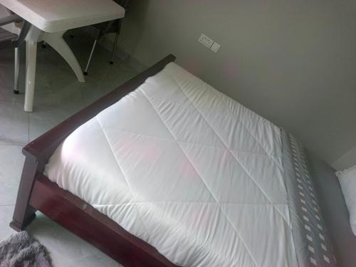 Ένα ή περισσότερα κρεβάτια σε δωμάτιο στο Guardian Motel