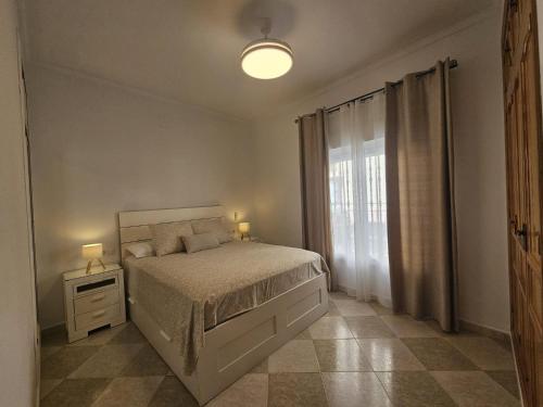 Ένα ή περισσότερα κρεβάτια σε δωμάτιο στο El Descanso de Chipiona