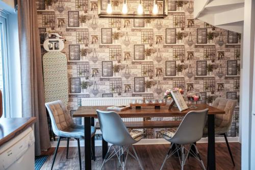 a dining room with a table and chairs at Norwich, Lavender House, 3 Bedroom House, Private Parking and Garden in Norwich