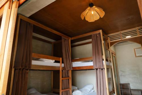 Ένα ή περισσότερα κρεβάτια σε δωμάτιο στο Kayan Siargao