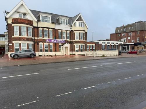a car parked in front of a building on a street at majestic hotel in Great Yarmouth