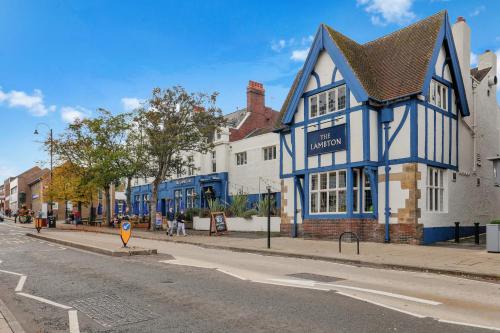 a blue and white building on the side of a street at The Lambton in Durham