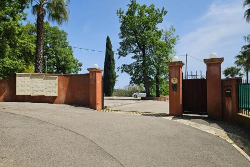 a gate to a driveway with a fence at Nature Studio Garden & Parking Grasse Hills in Grasse