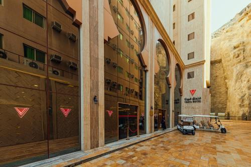 a shopping mall with a cart in the middle of a street at VERTA Almahbas Hotel in Makkah
