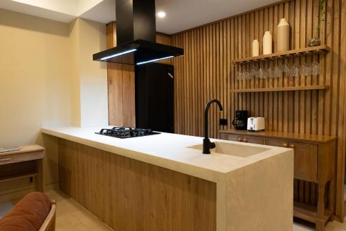 a kitchen with a sink and a stove at Casa Chance in Cartagena de Indias
