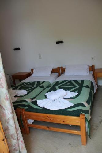 Ένα ή περισσότερα κρεβάτια σε δωμάτιο στο Hotel Alkyon