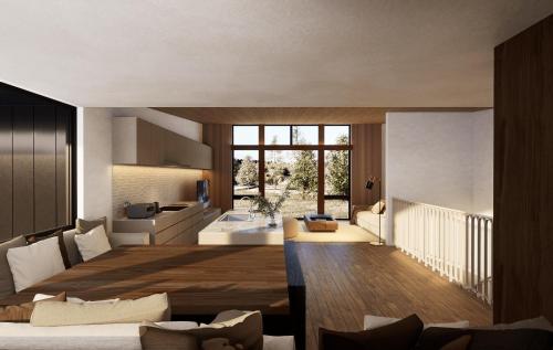 ein Wohnzimmer mit Möbeln und einem großen Fenster in der Unterkunft Amber Echoland MrT by Jade Group in Hakuba