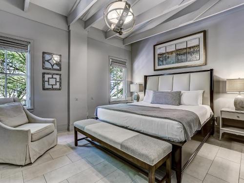 a bedroom with a large bed and a chair at Parker's Collection - 6 Bedroom in Savannah