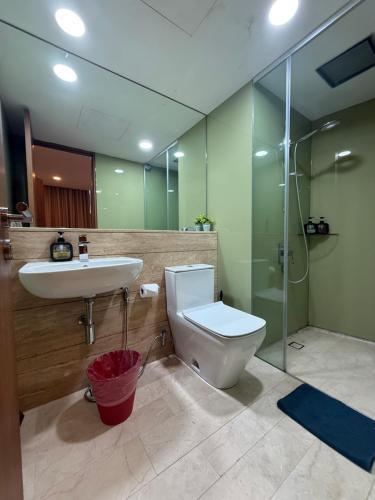 a bathroom with a toilet and a sink and a shower at Vortex klcc lotus in Kuala Lumpur