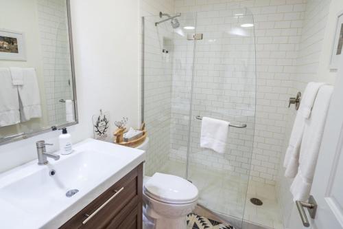 a bathroom with a shower and a toilet and a sink at RMR: Spruces 13 - The Elks Condo in The Aspens in Wilson