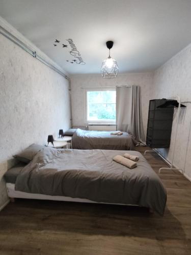 Ένα ή περισσότερα κρεβάτια σε δωμάτιο στο Revontuli House