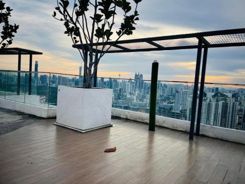 a vase with a tree on top of a building at Reizz Residence by Perkasa Suites in Batu Empat