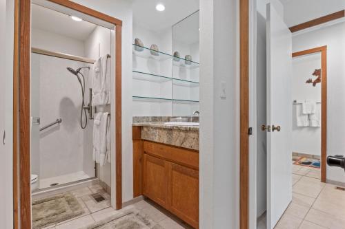 a bathroom with a shower and a sink at RMR: Cinquefoil 1613 Condo in The AspensWilsonWY in Wilson