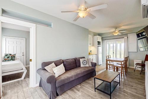 a living room with a couch and a table at Lost Colony Lost Sea Turtle in Port Aransas