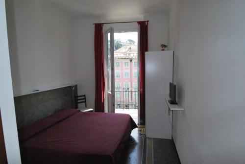 Postel nebo postele na pokoji v ubytování Albergo La Vela