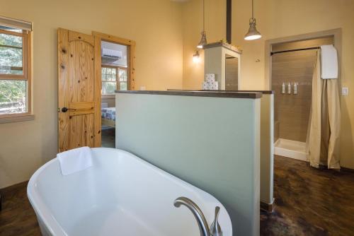 a bathroom with a white counter in a room at Creekside Cowa-Bungalow - 61 E 200 - Studio in Moab