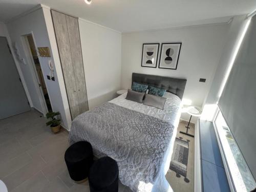 Una cama o camas en una habitación de Depto Nuevo Exclusivo con Estacionamiento