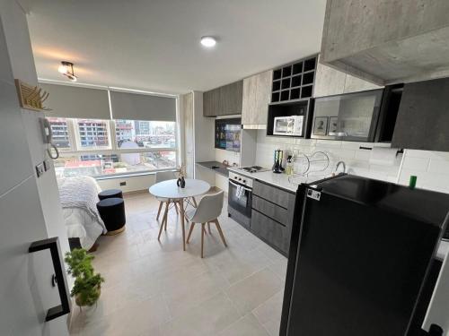 Una cocina o cocineta en Depto Nuevo Exclusivo con Estacionamiento