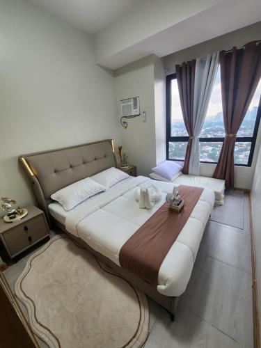 Ένα ή περισσότερα κρεβάτια σε δωμάτιο στο Congressional Town Center Tower 2