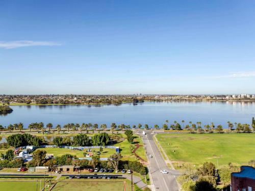 an aerial view of a river with a city at ibis Styles East Perth in Perth