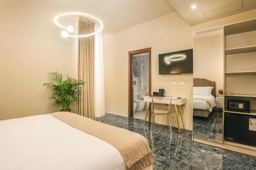 Postel nebo postele na pokoji v ubytování Roma suite hotel