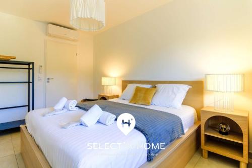 Katil atau katil-katil dalam bilik di SELECT'soHOME- Appartement pour 3 personnes dans une résidence neuve - Piscine et parking privé - SOLEA