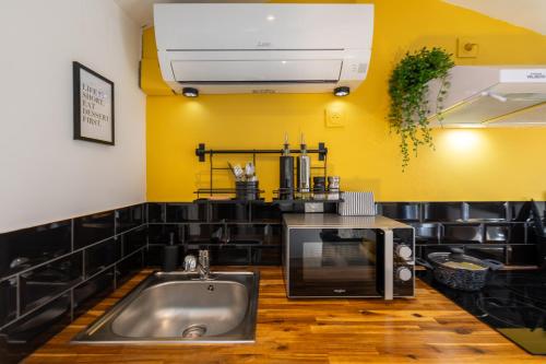 Kuchyň nebo kuchyňský kout v ubytování Le Sunny - Cocon Lumineux au Cœur de Castres