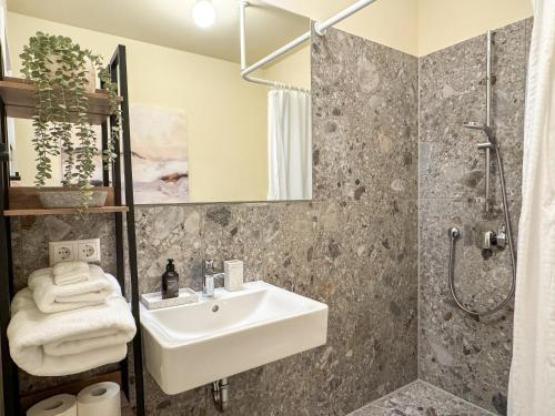 a bathroom with a sink and a shower at Studio Apartments Lumper Höhe in Ravensburg