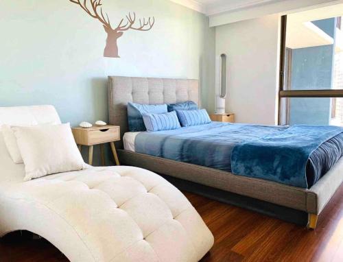 Llit o llits en una habitació de Absolute Beach front apartment