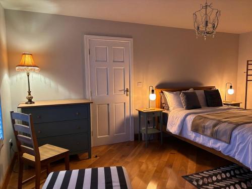 a bedroom with a bed and a desk and a chair at apartment cavan in Cavan