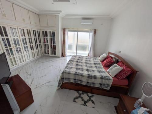 Ένα ή περισσότερα κρεβάτια σε δωμάτιο στο Appartement spacieux tout confort