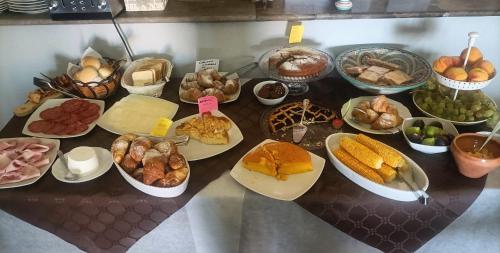 a table topped with lots of different types of food at Agriturismo Al Casale in Donnafugata