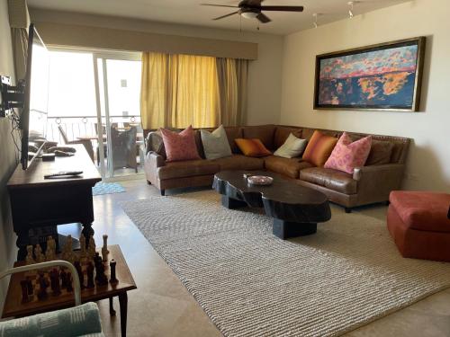 a living room with a couch and a table at Tortuga Bay TBB 2502 in San José del Cabo