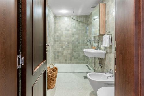 a bathroom with a sink and a toilet at Sponza House in Trstenik