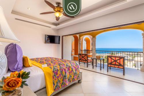 a bedroom with a bed and a view of the ocean at 2BR Condo with Private Terrace - Ocean View - Pool in El Tule