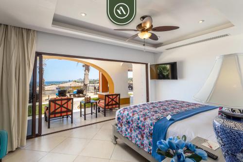 a bedroom with a bed and a balcony at 2BR House with Ocean View in Cabo in El Tule
