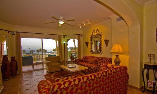 a living room with couches and a table at Las Mañanitas LM E3303 in San José del Cabo