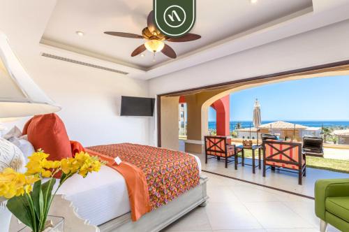 a bedroom with a bed and a view of the ocean at Great Condo with Private Balcony - Ocean View in El Tule