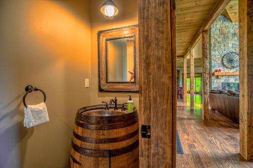 a bathroom with a barrel sink and a mirror at Mountain Estate Main House in Newry